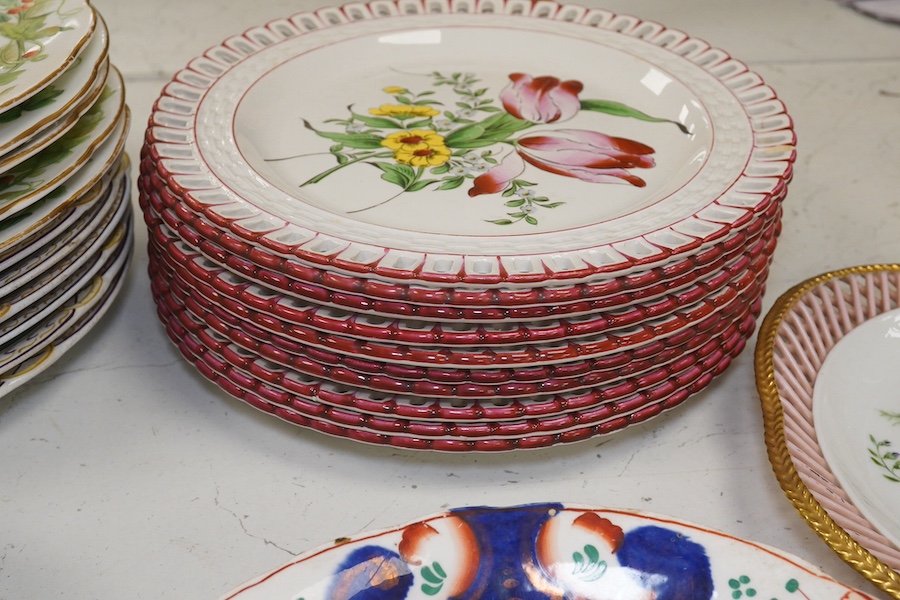 Ten French Luneville floral plates, a hand painted basket edged plate and various part dinner service plates, 24cm in diameter. Condition - mostly fair to good